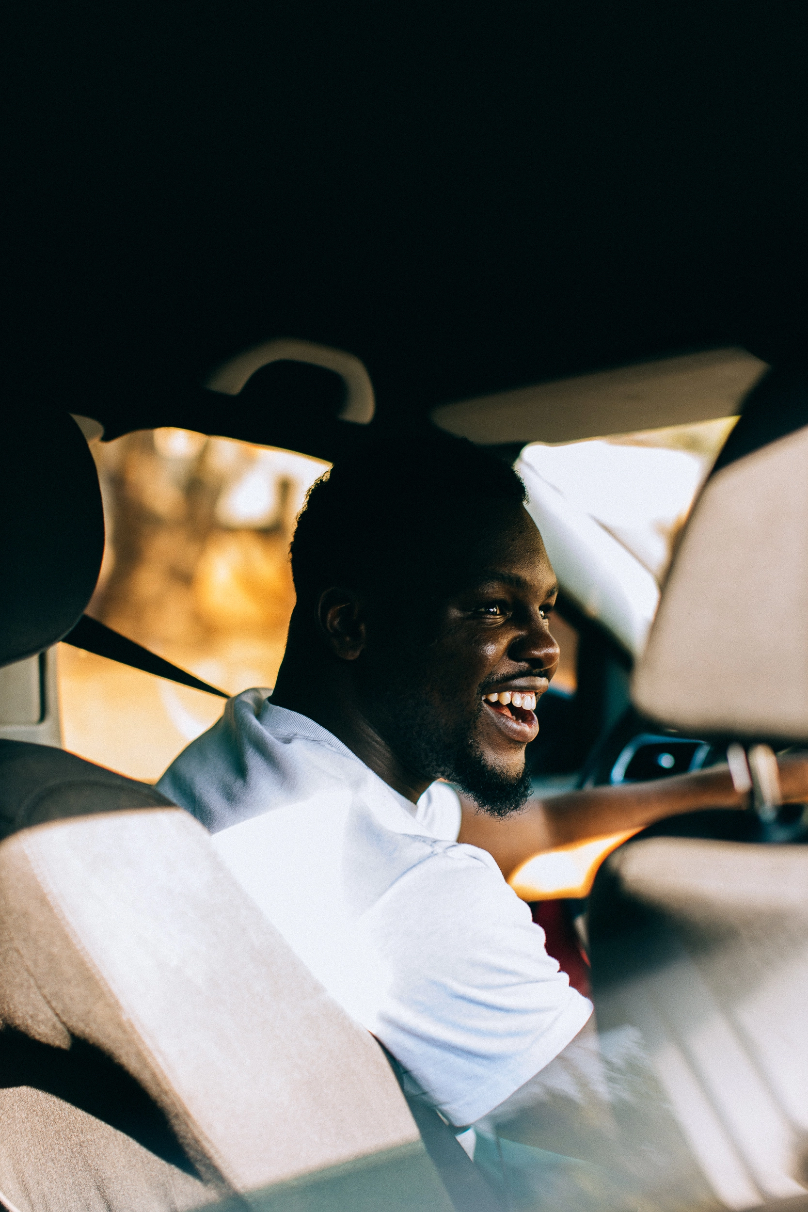 Dryver smiling in car